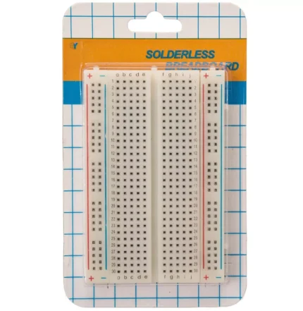 Plaque de prototypage sans soudure emballée sur fond quadrillé